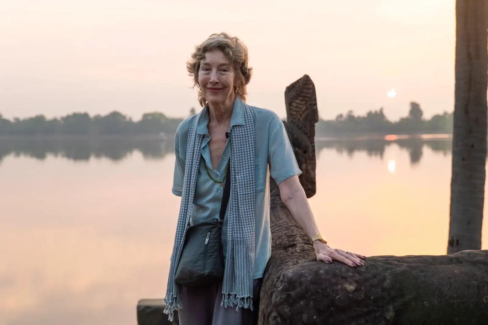 Susan standing at sunset by the lake - Cambodia retreat