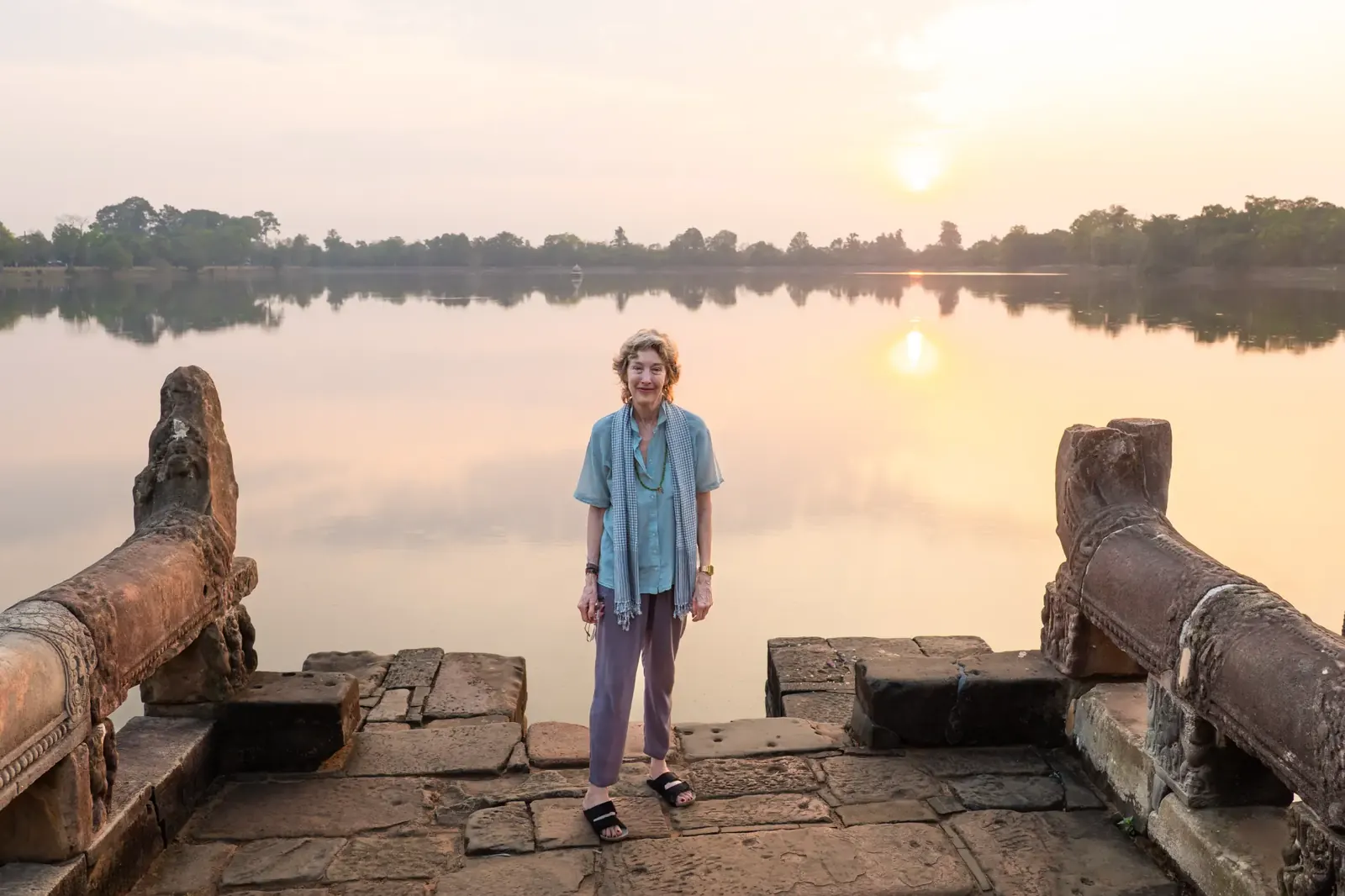 Retreat participants silhouetted at sunset - Cambodia