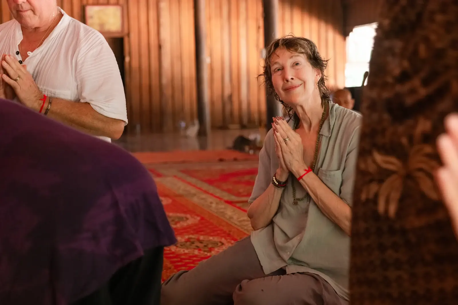 Susan receiving blessing from monk - Cambodia retreat