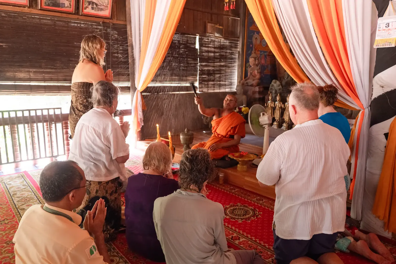 Retreat group during monk blessing ceremony - Cambodia